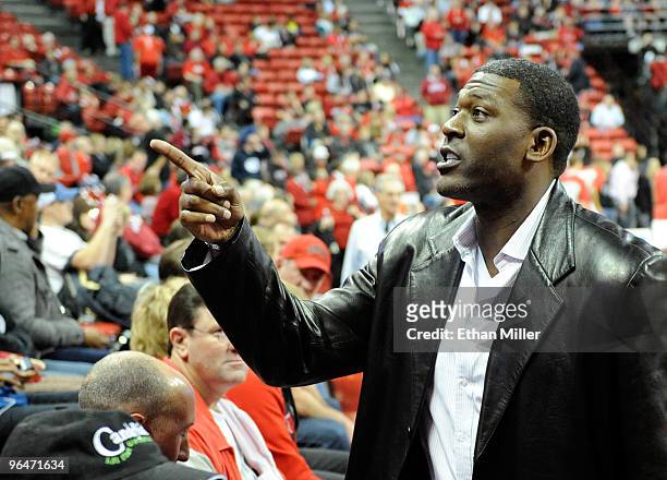 Former NBA and UNLV basketball player Larry Johnson greets fans before a game between the UNLV Rebels and the Brigham Young University Cougars at the...
