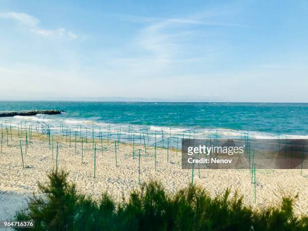 scenic view of beach against sky - pomorie stock-fotos und bilder