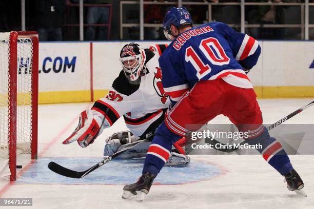 Marian Gaborik of the New York Rangers shoots a goal past goalkeeper Martin Brodeur of the New Jersey Devils during their game on February 6, 2010 at...