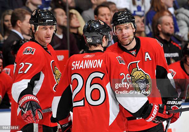 Alexei Kovalev, Ryan Shannon and Mike Fisher of the Ottawa Senators talk during a break in game action against the Toronto Maple Leafs February 6,...