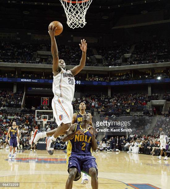 Raymond Felton of the Charlotte Bobcats goes for the layup against Darren Collison of the New Orleans Hornets on February 6, 2010 at the Time Warner...