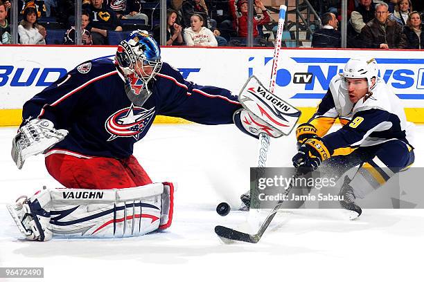 Goaltender Steve Mason of the Columbus Blue Jackets stops a shot from Derek Roy of the Buffalo Sabres during the third period on February 6, 2010 at...