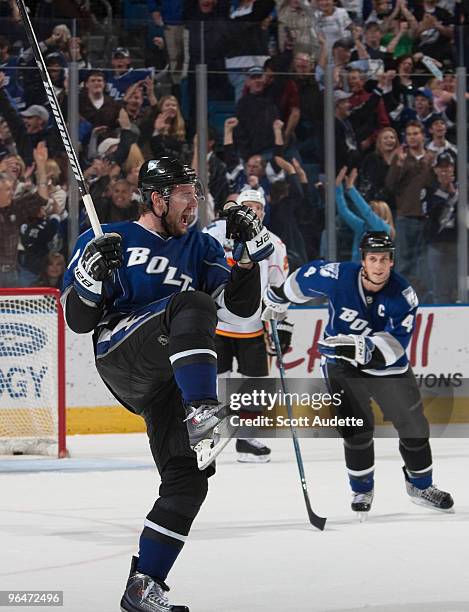 Andrej Meszaros of the Tampa Bay Lightning reacts after scoring the game winning goal in overtime against the Calgary Flames at the St. Pete Times...