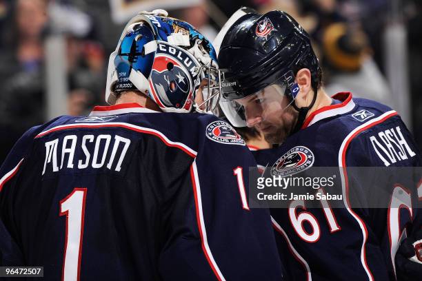 Steve Mason is congratulated by teammate Rick Nash, both of the Columbus Blue Jackets after Mason stopped all 28 shots that he faced in 4-0 shutout...