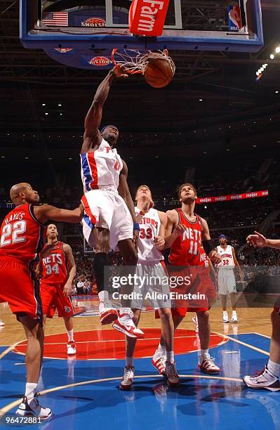 Ben Wallace of the Detroit Pistons goes up for a dunk over Jarvis Hayes of the New Jersey Nets in a game at the Palace of Auburn Hills on February 6,...