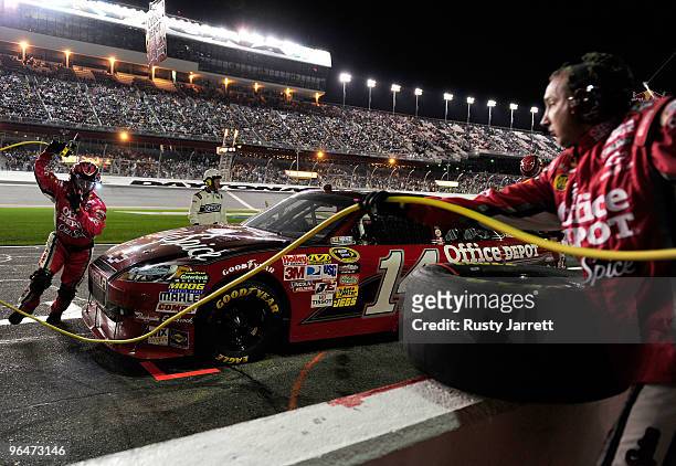 Tony Stewart, driver of the Old Spice Chevrolet, comes in for service during the Budweiser Shootout at Daytona International Speedway on February 6,...