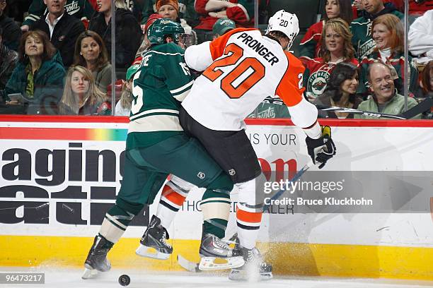 Andrew Brunette of the Minnesota Wild and Chris Pronger of the Philadelphia Flyers collide during the game at the Xcel Energy Center on February 6,...