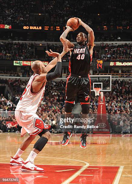 Udonis Haslem of the Miami Heat shoots a jumper over Taj Gibson of the Chicago Bulls during the NBA game on February 6, 2010 at the United Center in...