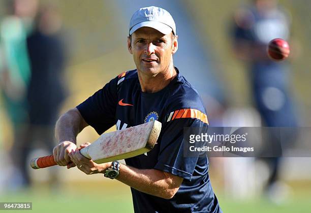 India coach Gary Kirsten of India gives slip practice before day two of the First Test match between India and South Africa at the Vidarbha Cricket...