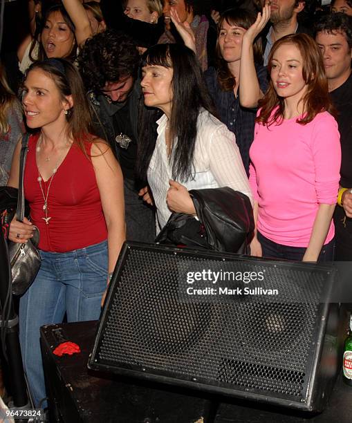 Actress Actress Rose McGowan watches a performance by Edward Sharpe & The Magnetic Zeros during Artists For Haiti benefit at Track 16 Gallery on...