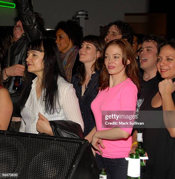 Actress Actress Rose McGowan watches a performance by Edward Sharpe & The Magnetic Zeros during Artists For Haiti benefit at Track 16 Gallery on...