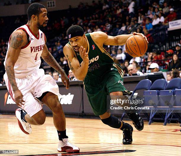 Desmon Farmer of the Reno Bighorns drives past Antonio Anderson of the Rio Grande Valley Vipers on February 6, 2010 at the State Farm Arena in...