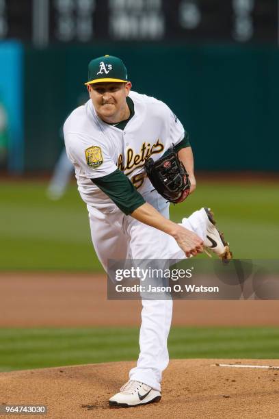 Trevor Cahill of the Oakland Athletics pitches against the Seattle Mariners during the first inning at the Oakland Coliseum on May 22, 2018 in...