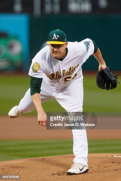 Trevor Cahill of the Oakland Athletics pitches against the Seattle Mariners during the first inning at the Oakland Coliseum on May 22, 2018 in...