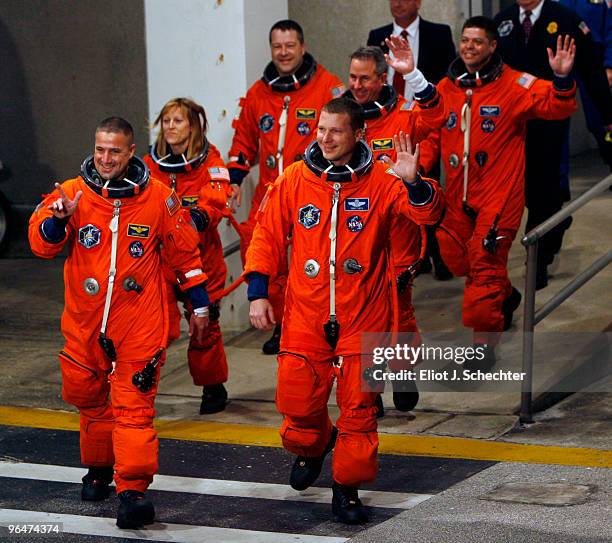 Space Shuttle Endeavour astronauts mission specialists Robert Behnken, Nicholas Patrick, Stephen Robinson, and Kathryn Hire, with pilot Terry Virts...