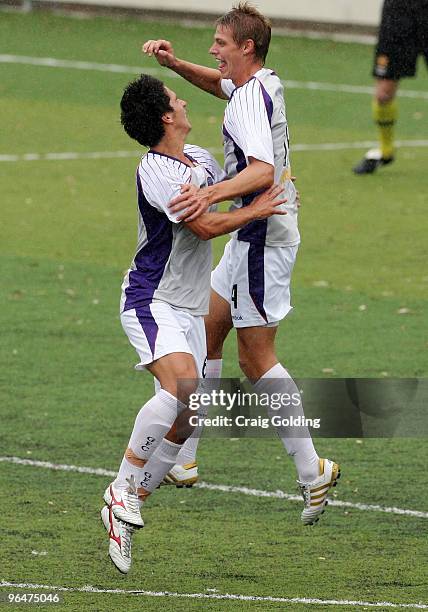 Dean Evans and Brent Griffiths of the Glory celebrate after Griffiths scored during the round 23 National Youth League match between Sydney FC and...