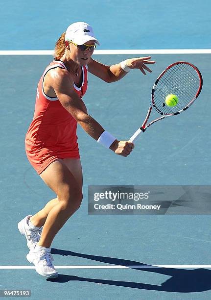 Sam Stosur of Australia plays a backhand volley in her singles match against Anabel Medina-Garrigues of Spain during the 2010 Fed Cup World Group II...