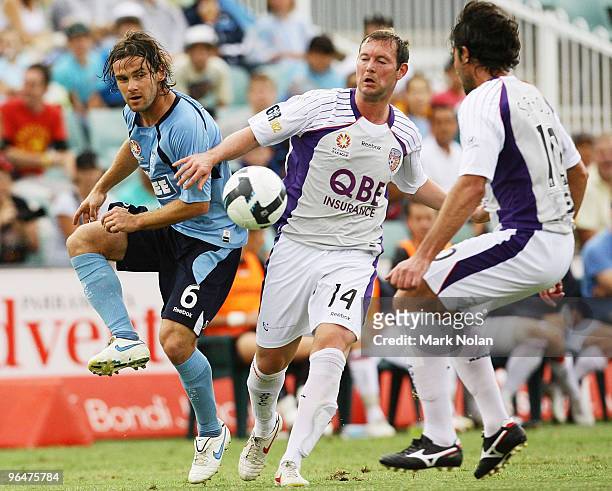 Karol Kisel of Sydney and Steven McGarry of Perth contest possession during the round 26 A-League match between Sydney FC and the Perth Glory at...