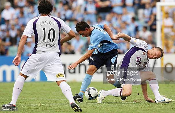 Stuart Musialik of Sydney and Daniel McBreen of Perth contest possession during the round 26 A-League match between Sydney FC and the Perth Glory at...