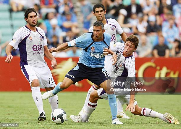 Steve Corica of Sydney takes on the Perth defence during the round 26 A-League match between Sydney FC and the Perth Glory at Parramatta Stadium on...