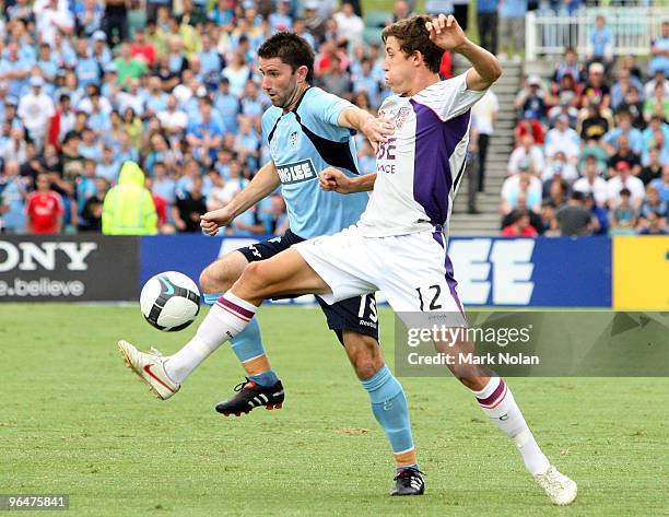 Terry McFlynn of Sydney and Scott Neville of Perth contest possession during the round 26 A-League match between Sydney FC and the Perth Glory at...