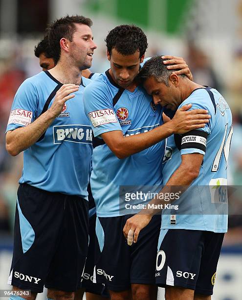 Steve Corica of Sydney celebrates with Terry McFlynn and Alex Brosque after scoring a first half goal during the round 26 A-League match between...