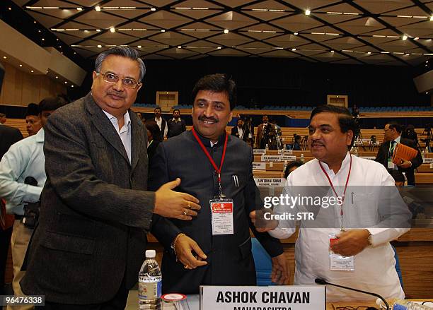 India's Chhattisgarh state Chief Minister Raman Singh, Maharashtra CM Ashok Chavan and Maharashtra Deputy CM R.R. Patil chat during the Chief...