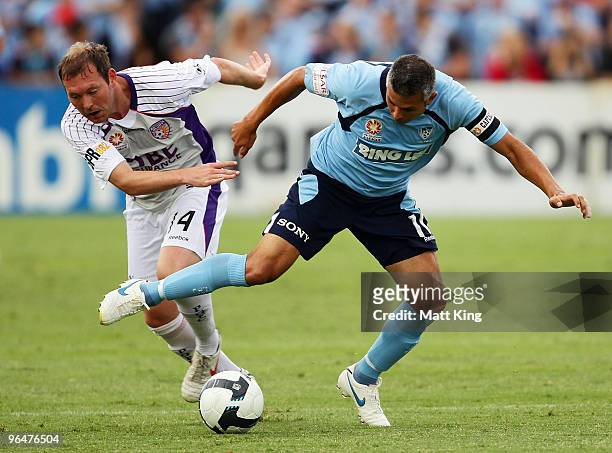 Steve Corica of Sydney is challenged by Steven McGarry of the Glory during the round 26 A-League match between Sydney FC and the Perth Glory at...