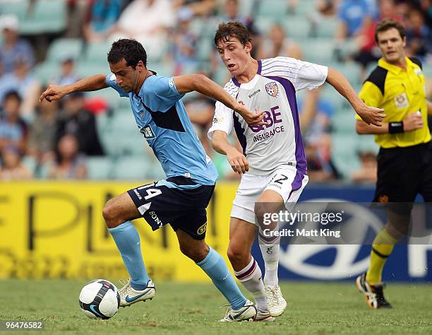 Alex Brosque of Sydney gets away from Scott Neville of the Glory during the round 26 A-League match between Sydney FC and the Perth Glory at...