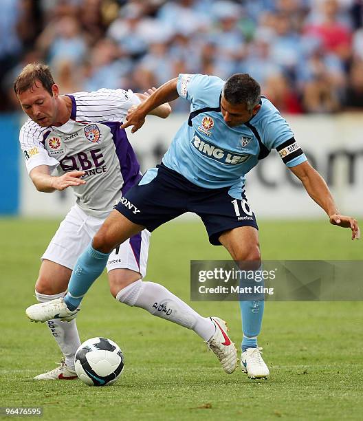 Steve Corica of Sydney is challenged by Steven McGarry of the Glory during the round 26 A-League match between Sydney FC and the Perth Glory at...