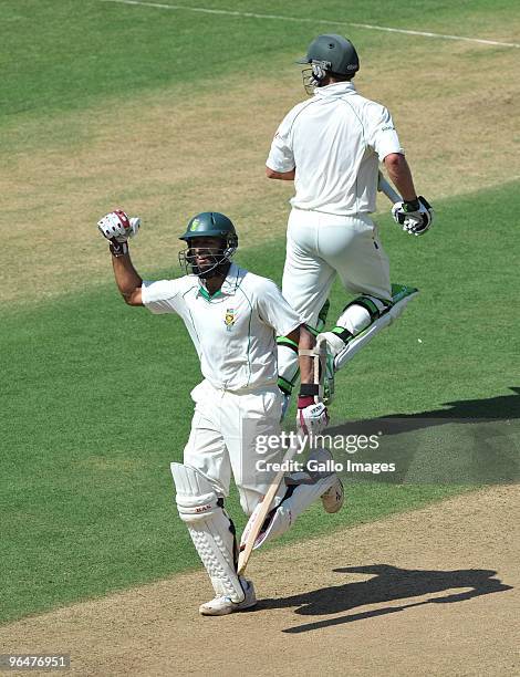 Hashim Amla of South Africa celebrates his 200 runs with AB de Villiers during day two of the First Test match between India and South Africa at the...