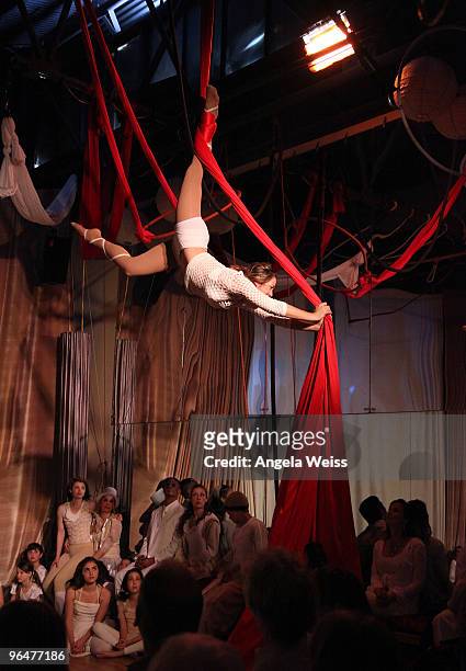 An aerialist performs at the 'Hands For Haiti' acoustic cirque show to benefit Doctors Without Borders at Le Studio Theater Space on February 6, 2010...
