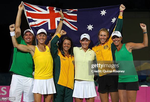 The Australian team of David Taylor, Rennae Stubbs, Casey Dellacqua, Sam Stosur, Alicia Molik and Nicole Bradtke celebrate winning their 2010 Fed Cup...