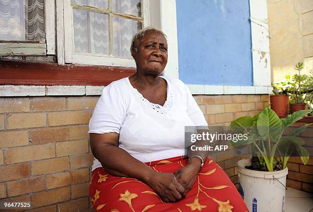 Catherine Jeremiah sits in front of her house on February 3, 2010 in a small mixed-race community in Kliptown, south of Johannesburg. Catherine...