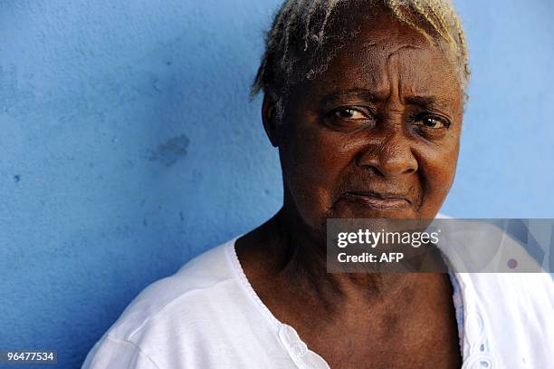 Catherine Jeremiah sits in front of her house on February 3, 2010 in a small mixed-race community in Kliptown, south of Johannesburg. Catherine...