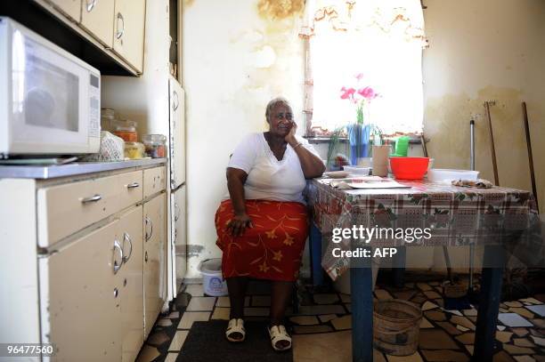 Catherine Jeremiah sits in the kitchen of her house on February 3, 2010 in a small mixed-race community in Kliptown, south of Johannesburg. Catherine...