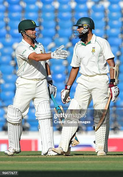Hashim Amla of South Africa celebrates his 250 runs with Mark Boucher during day two of the First Test match between India and South Africa at the...