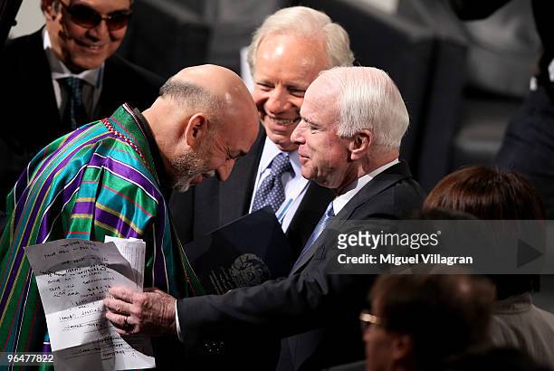 Senators Joseph Lieberman and John McCain talk to Afghan President Hamid Karzai during the 46th Munich Security Conference at the Bayerischer Hof...