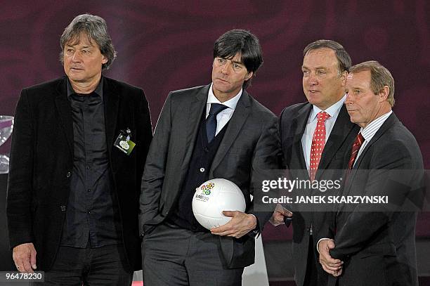 Coaches of group A Austria Dietmar Constantini, Germany Joachim Low , The Netherlands Dick Advocaat, and Azerbaijan Berti Vogts smile on the stage...