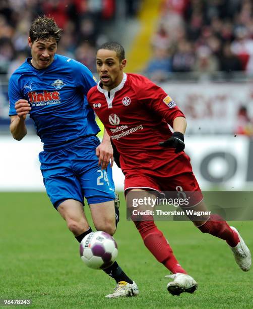 Sidney Sam of Kaiserslautern battles for the ball with Christian Strohdiek of Paderborn during the Second Bundesliga match between 1.FC...