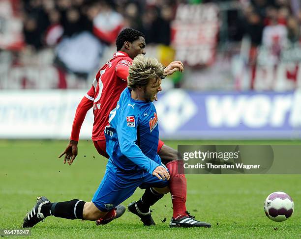 Georges Mandjeck of Kaiserslautern battles for the ball with Markus Kroesche of Paderborn during the Second Bundesliga match between 1.FC...