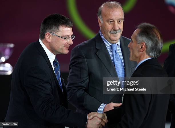 Craig Levein coach of Scotland shakes hands with Hans-Peter Zaugg coach of Liechtenstein as Vicente del Bosque coach of Spain looks on after being...