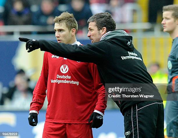 Head coach Marco Kurz of Kaiserslautern talks with Erik Jendrisek during the Second Bundesliga match between 1.FC Kaiserslautern and SC Paderborn at...