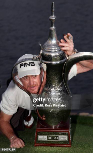 Miguel Angel Jimenez of Spain with the winners trophyt after the final round of the Omega Dubai Desert Classic on the Majlis Course at the Emirates...