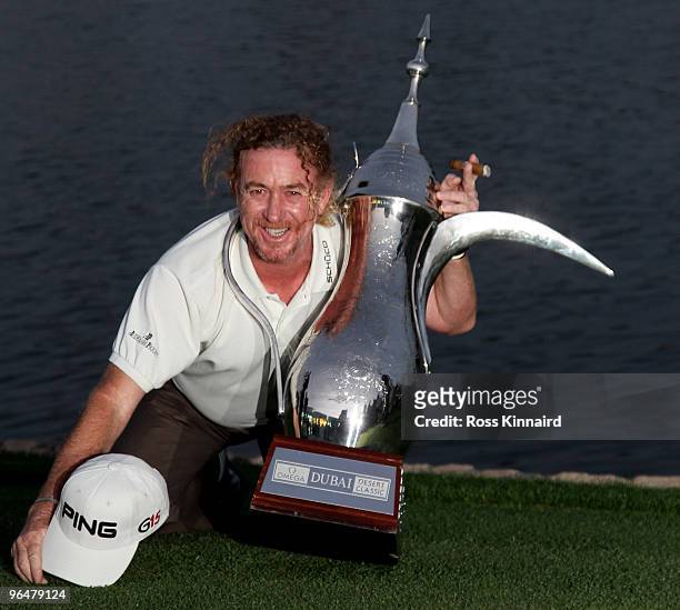Miguel Angel Jimenez of Spain with the winners trophyt after the final round of the Omega Dubai Desert Classic on the Majlis Course at the Emirates...