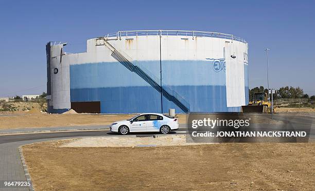 An electric car drives at the first electric vehicle demonstration centre in Ramat Hasharon near Tel Aviv on February 7, 2010. The centre, built by...