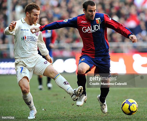 Rodrigo Palacio of Genoa CFC battles for the ball against Michele Marcolini of AC Chievo Verona during the Serie A match between Genoa CFC and AC...