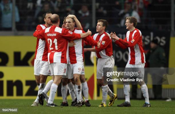 Bo Svensson of Mainz is celebrated after scoring his team's first goal during the Bundesliga match between FSV Mainz 05 and Borussia Moenchengladbach...