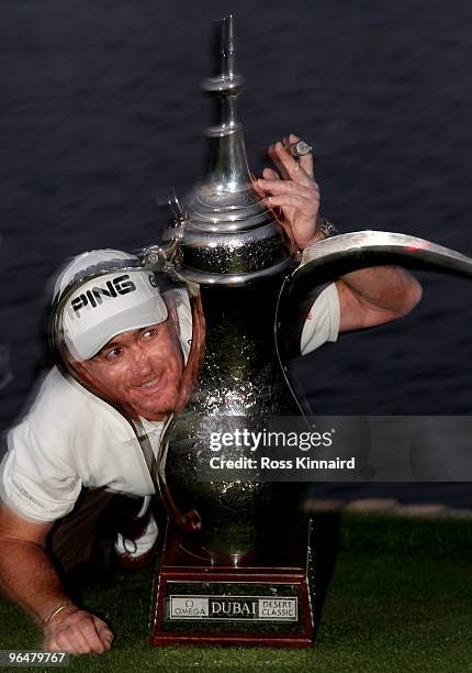 Miguel Angel Jimenez of Spain with the winners trophyt after the final round of the Omega Dubai Desert Classic on the Majlis Course at the Emirates...