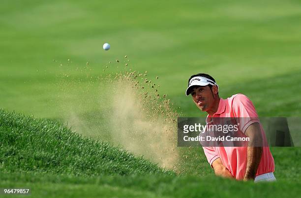 Alvaro Quiros of Spain plays his third shot at the 10th hole during the final round of the 2010 Omega Dubai Desert Classic on the Majilis Course at...